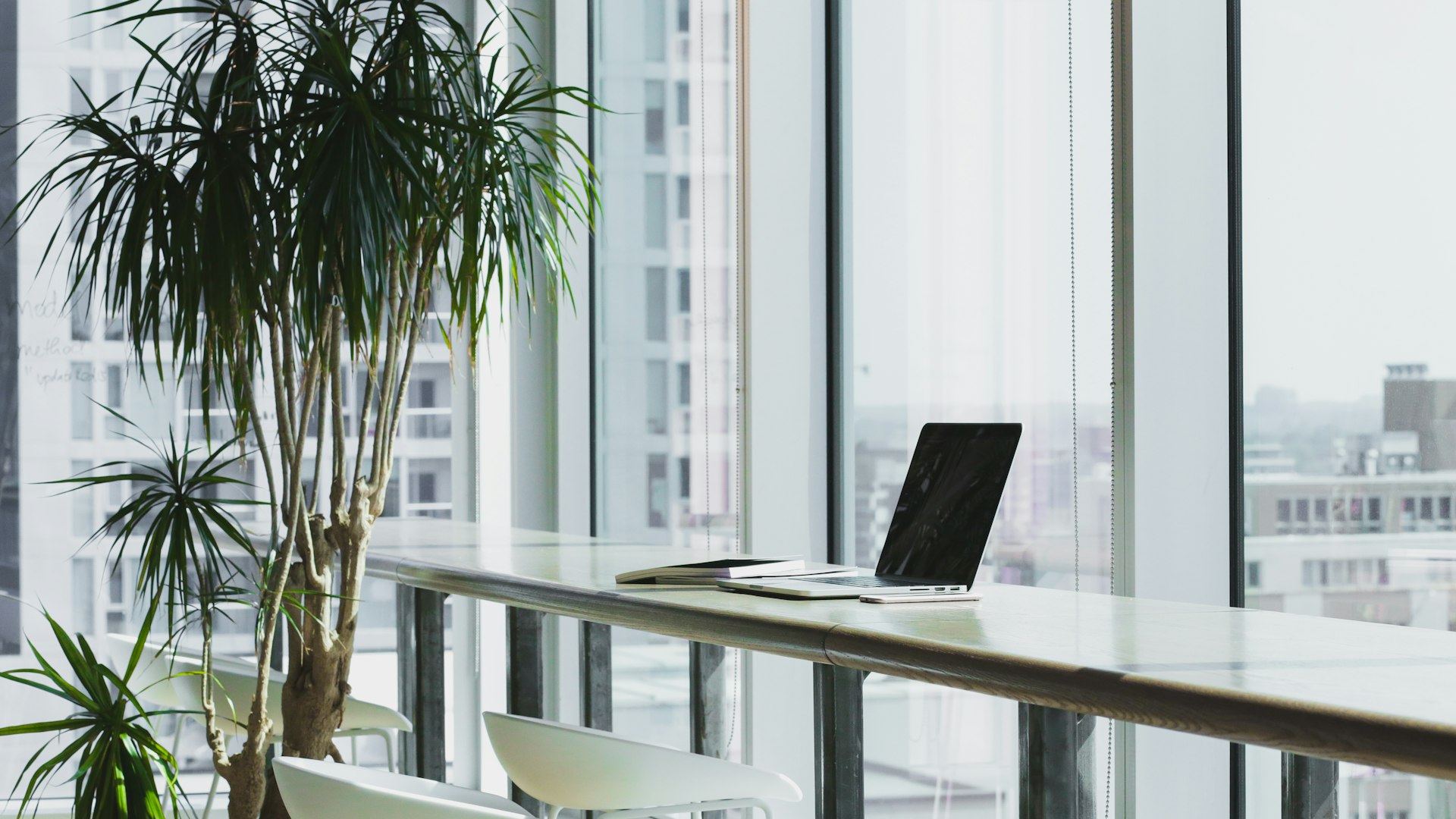 A quiet modern office workspace overlooking the city skyline